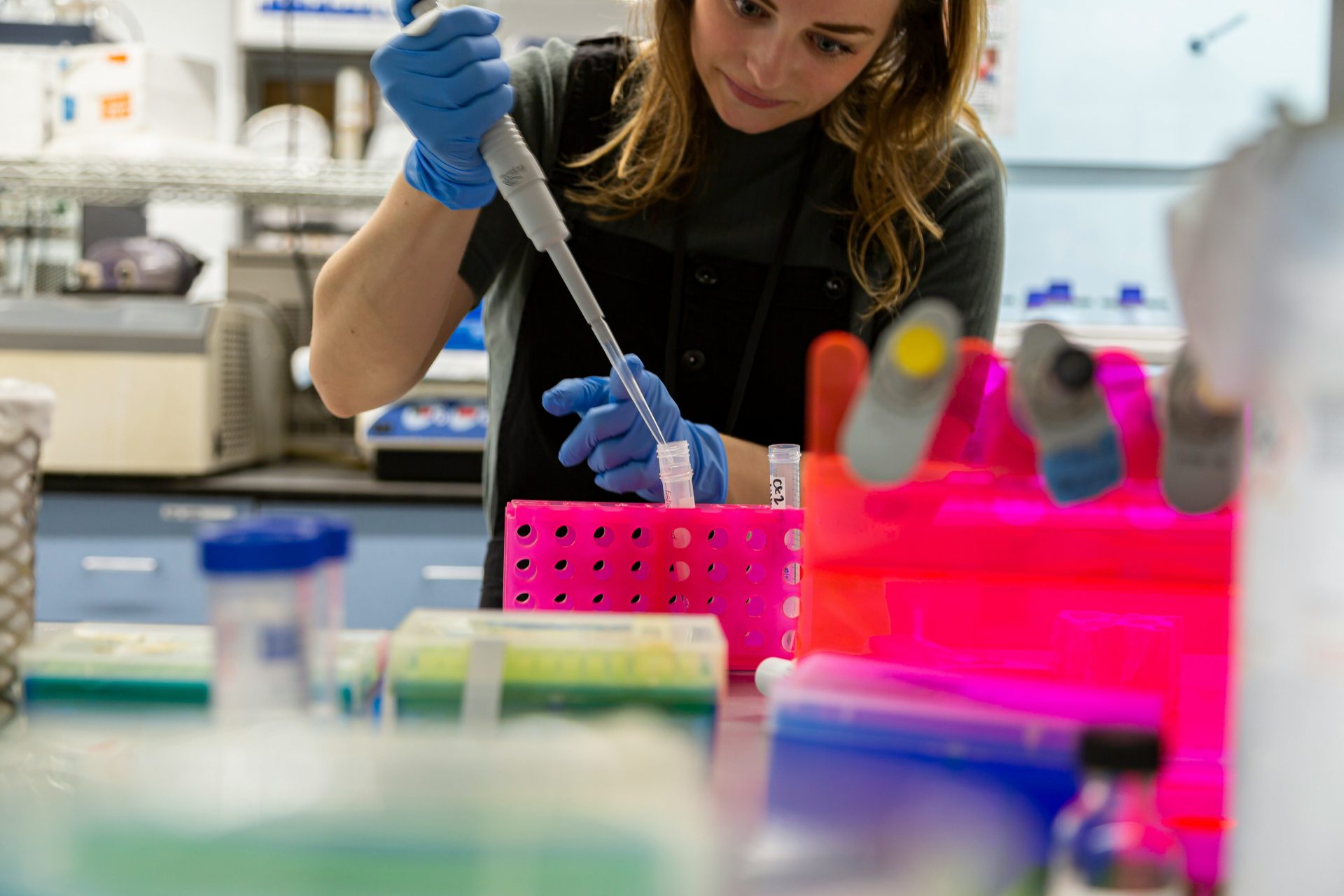 Scientist uses pipette in a laboratory.